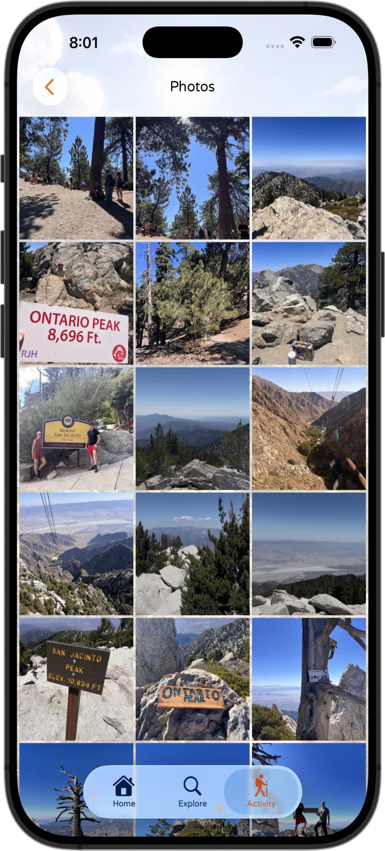 PeakDork iPhone screenshot — a grid gallery of summit photos from past climbs